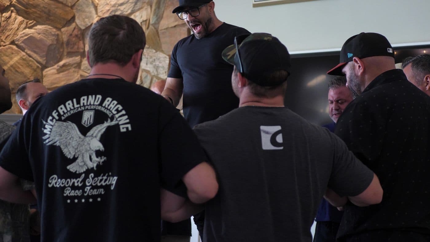Firebrand men gathered close, talking
