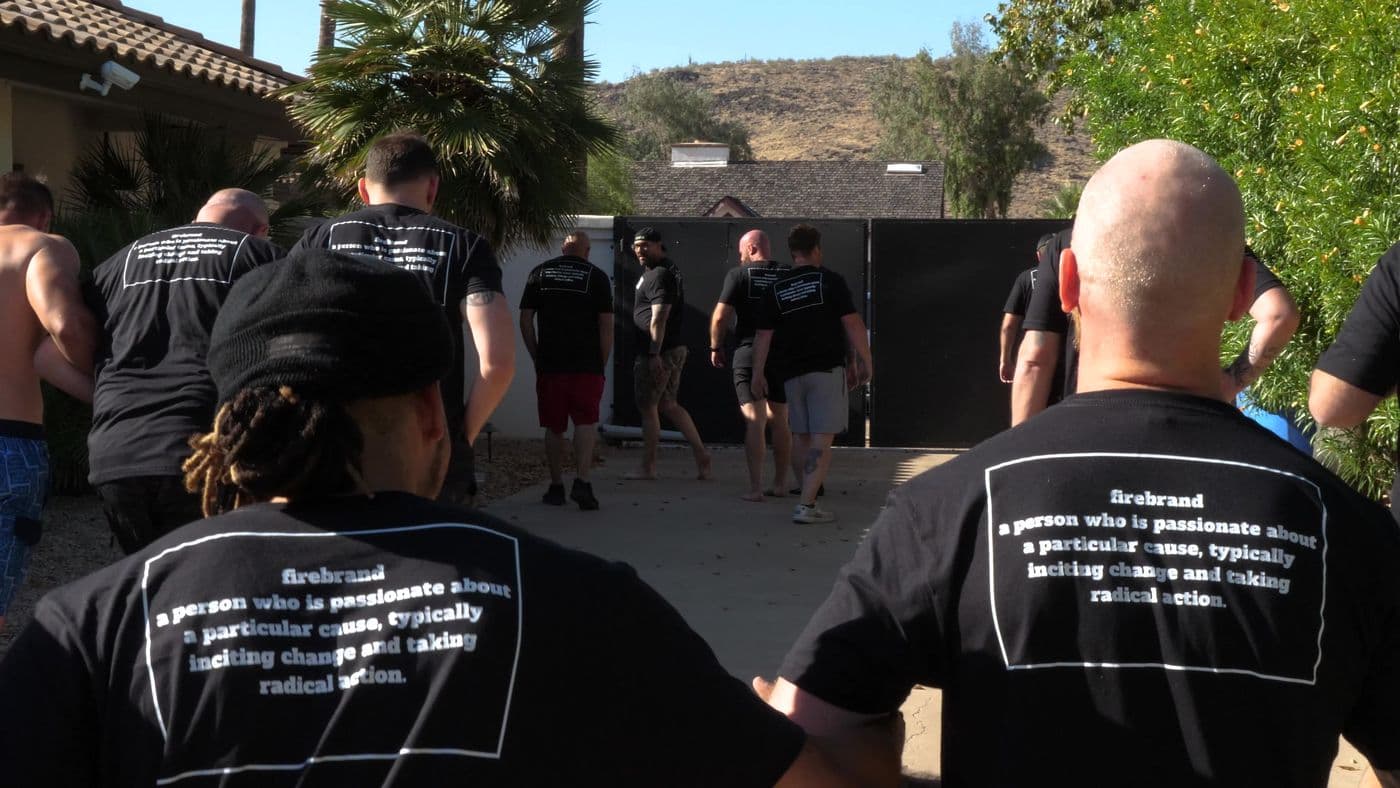 Men in Firebrand shirts walking outside the house at the Firebrand Intensive