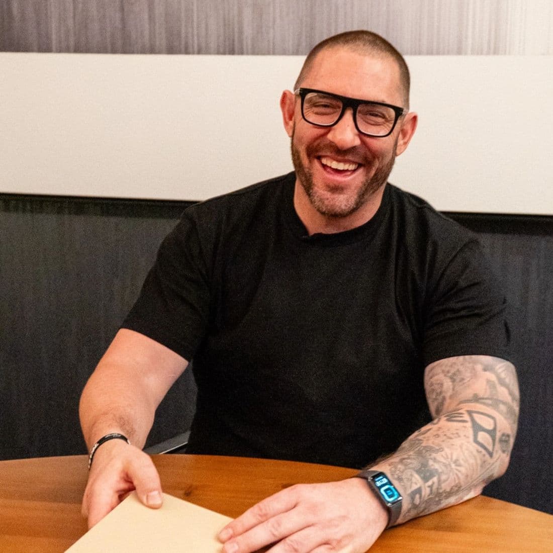 Justin Dewing, founder of Firebrand Initiative, at a table